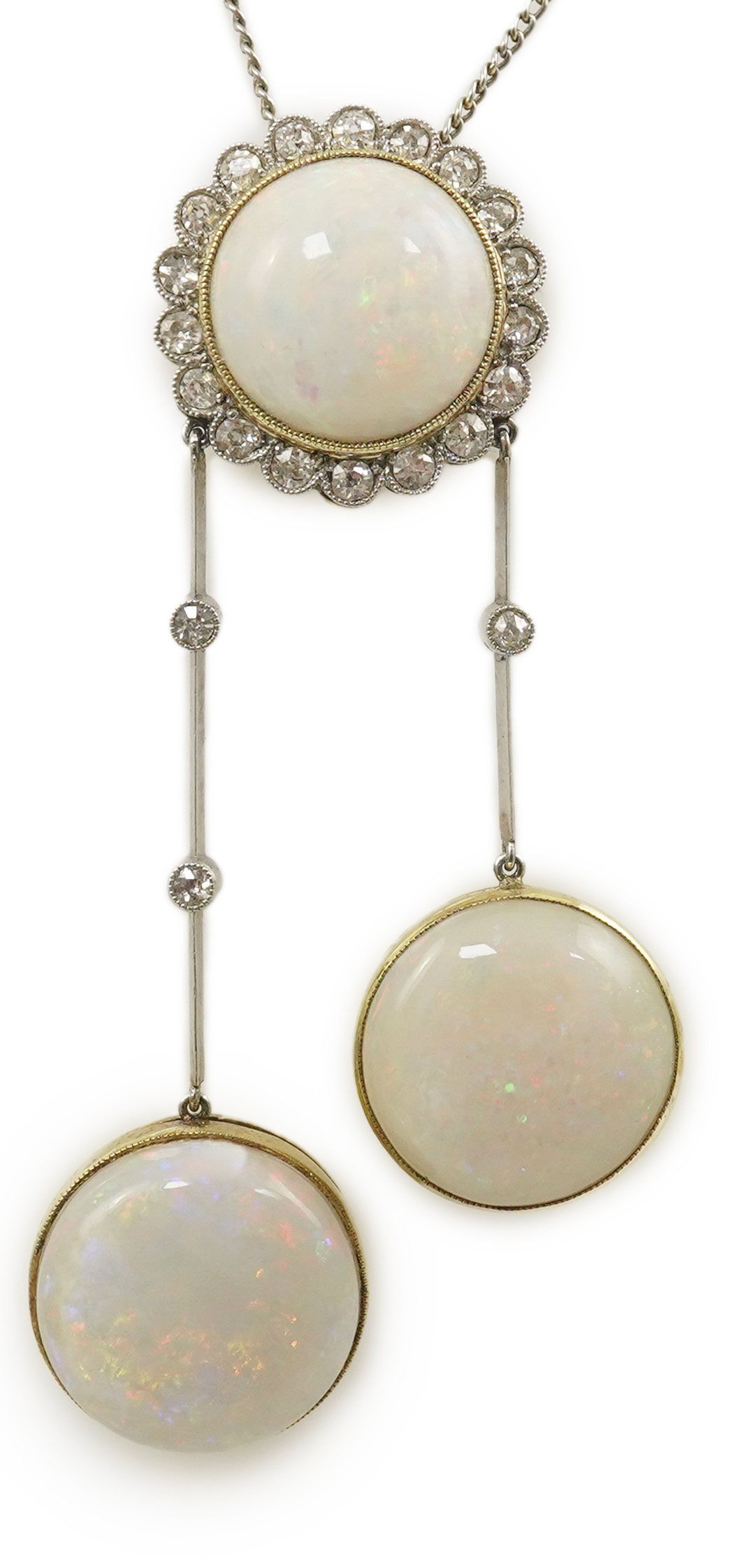 A Belle Epoque platinum and gold, white opal and millegrain set diamond double drop pendant necklace, the chain by Child and Child